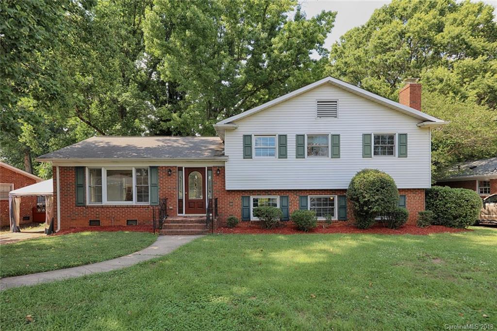 3327 Woodleaf Road Charlotte, NC 28205 - Photo 1 of 36 a front view of a house with a yard