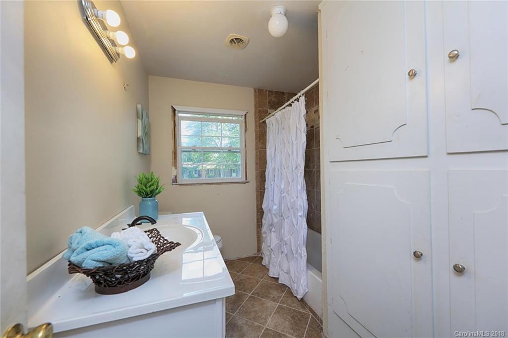 3327 Woodleaf Road Charlotte, NC 28205 - Photo 14 of 36 a room with a window and a potted plant