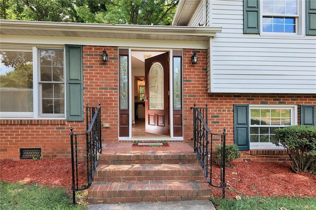 3327 Woodleaf Road Charlotte, NC 28205 - Photo 3 of 36 a front view of a house with a garden