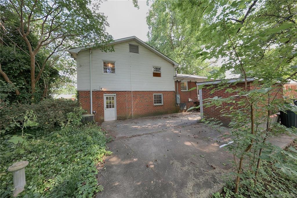 3327 Woodleaf Road Charlotte, NC 28205 - Photo 30 of 36 a view of a house with a yard