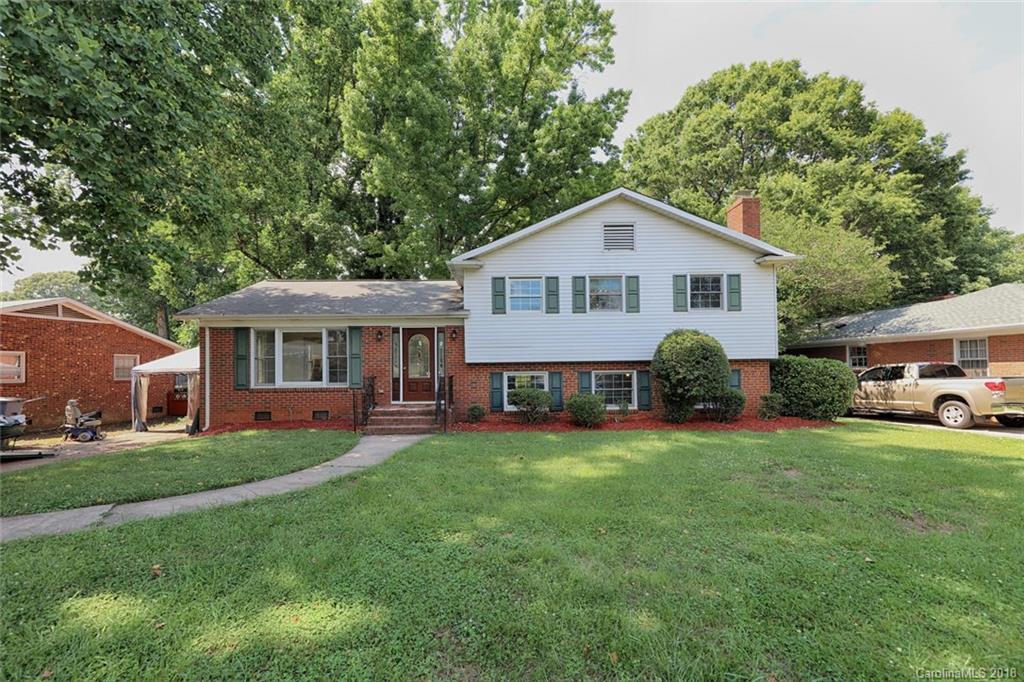 3327 Woodleaf Road Charlotte, NC 28205 - Photo 36 of 36 a front view of a house with a garden