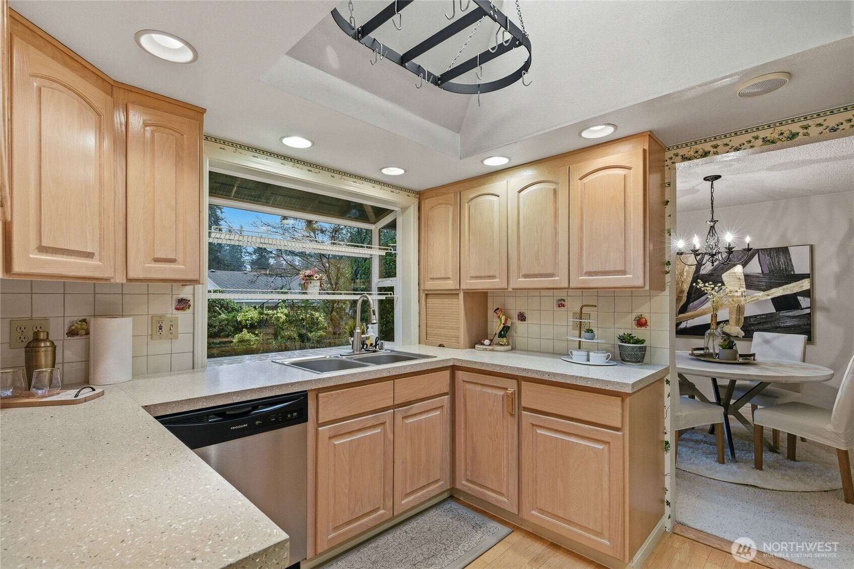 14523 Southeast 167th Street Renton, WA 98058 - Photo 14 of 39 a kitchen with a sink window and cabinets