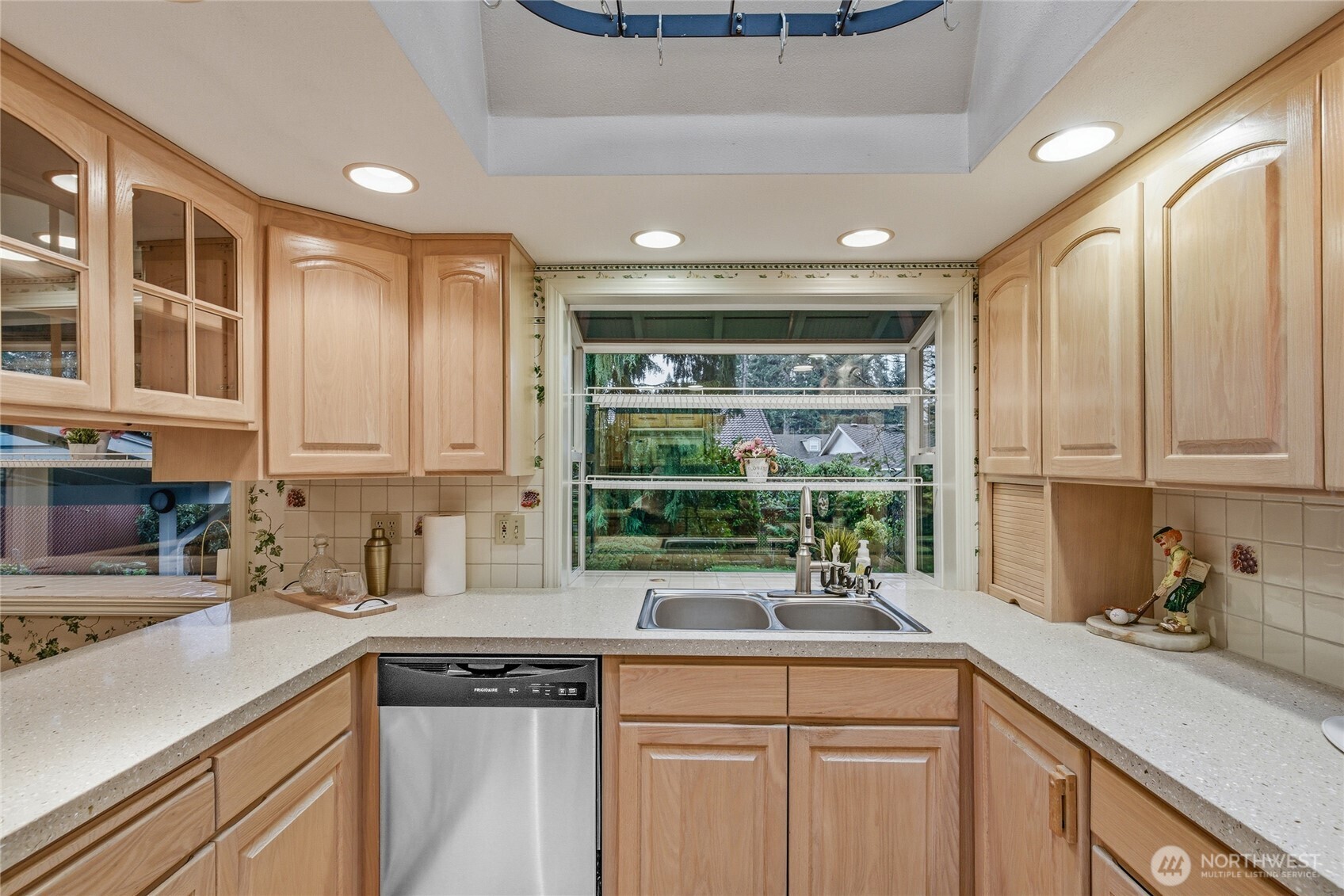 14523 Southeast 167th Street Renton, WA 98058 - Photo 15 of 39 a kitchen with stainless steel appliances granite countertop a sink and a window