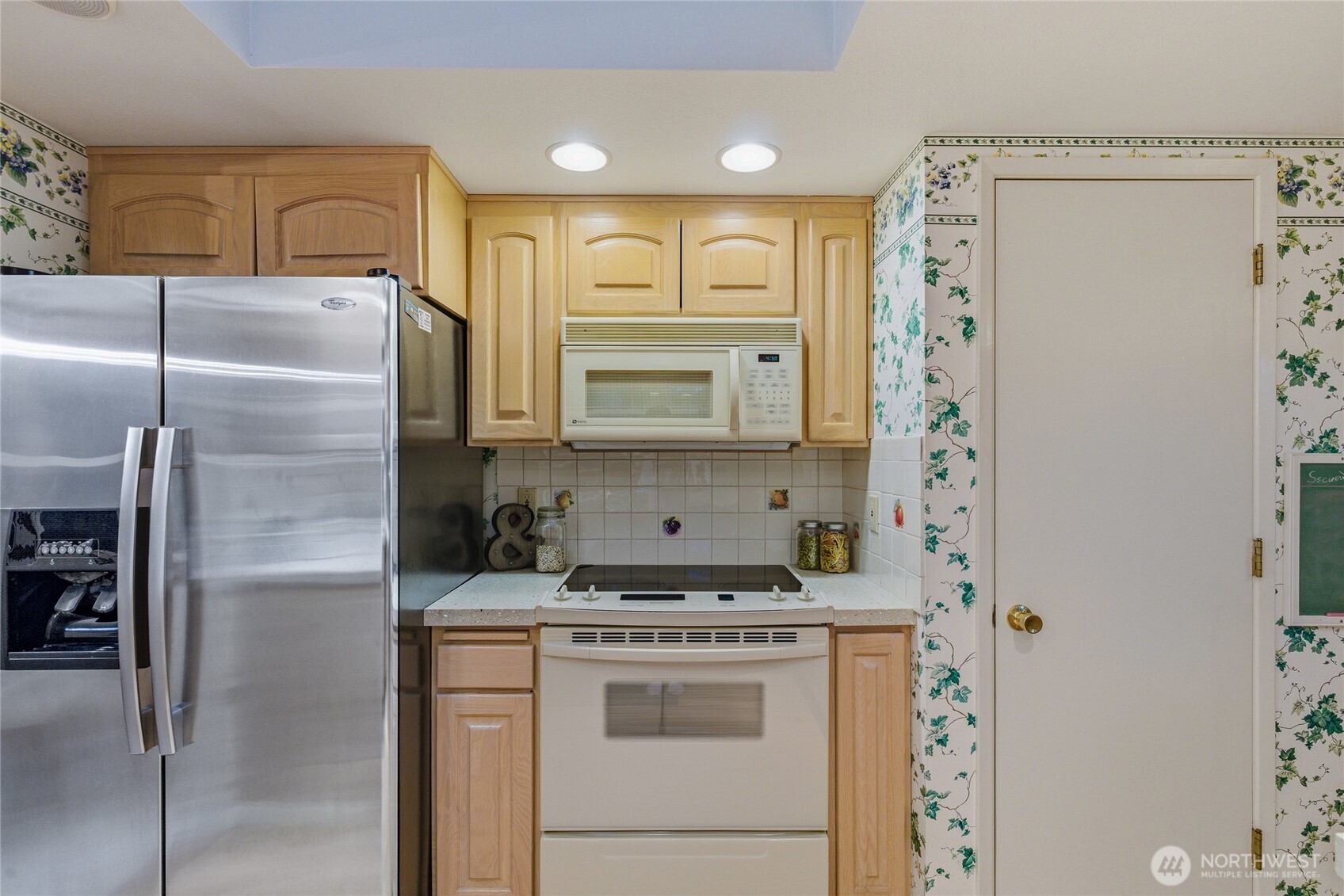 14523 Southeast 167th Street Renton, WA 98058 - Photo 19 of 39 a kitchen with stainless steel appliances granite countertop a refrigerator and a stove