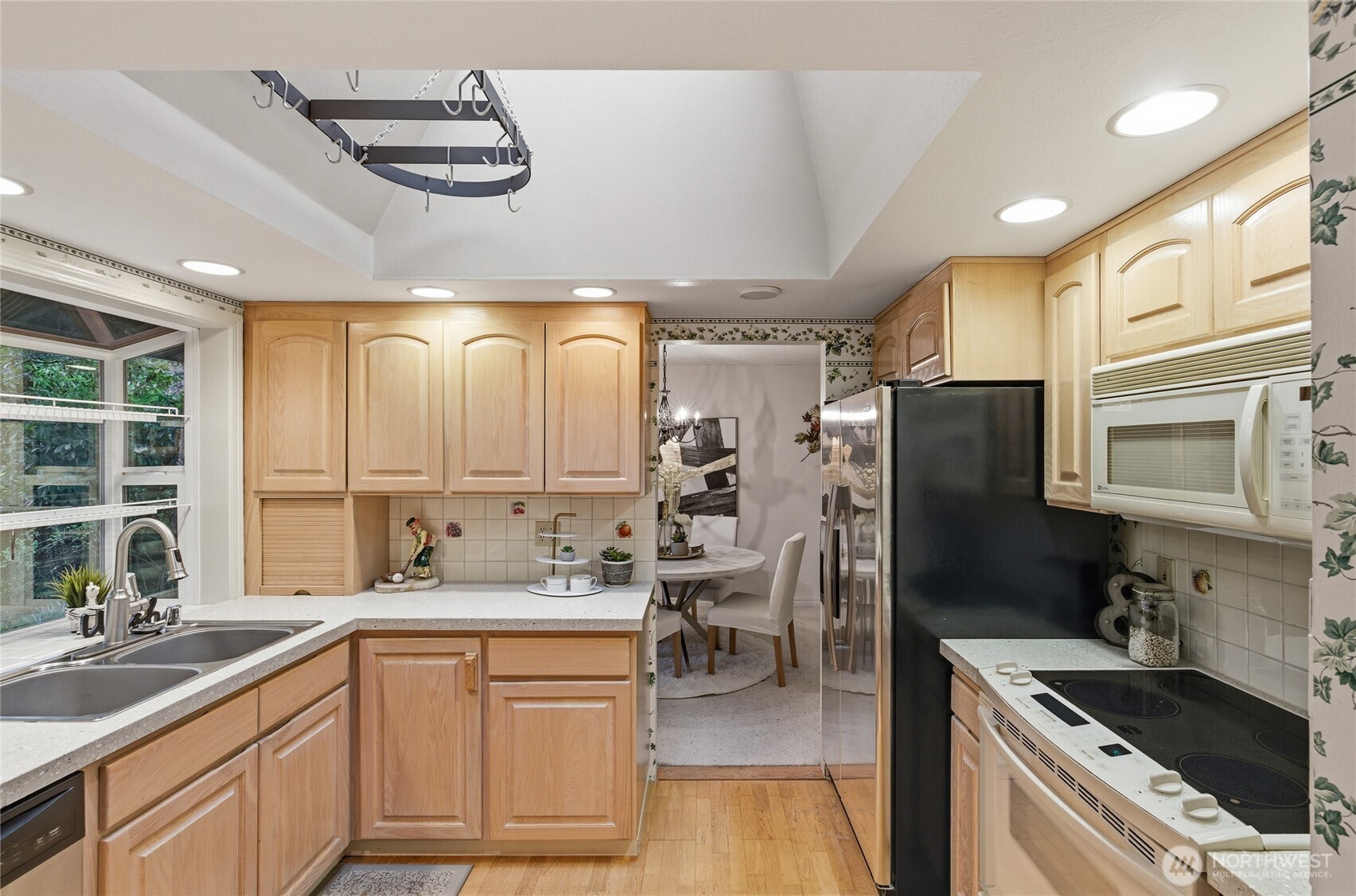 14523 Southeast 167th Street Renton, WA 98058 - Photo 20 of 39 a kitchen with stainless steel appliances granite countertop a sink stove and refrigerator
