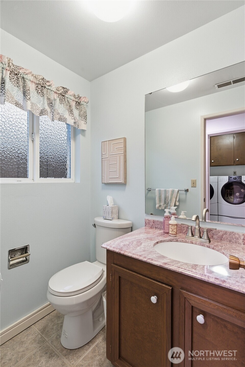 14523 Southeast 167th Street Renton, WA 98058 - Photo 30 of 39 a bathroom with a granite countertop sink a toilet and mirror