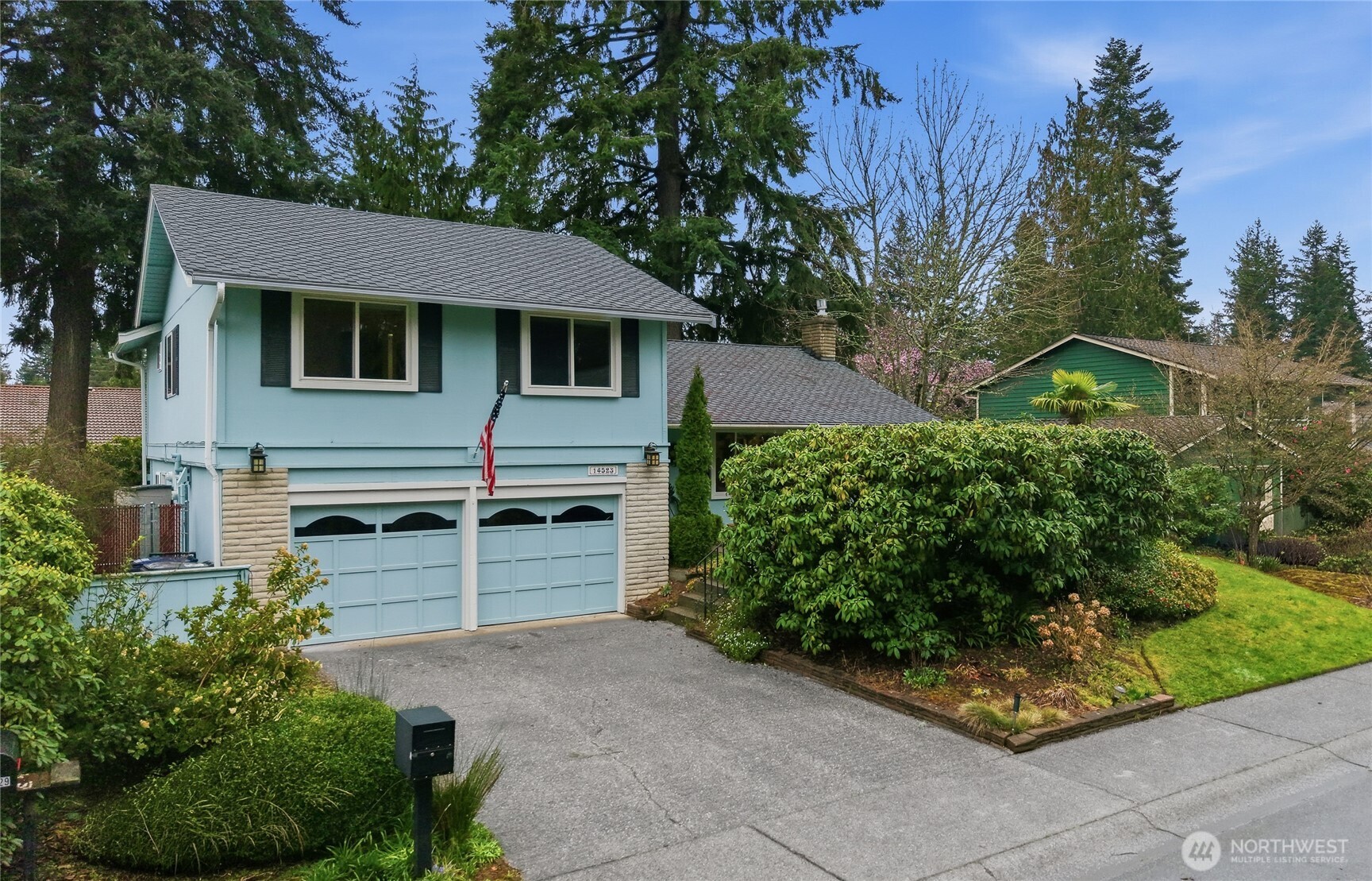 14523 Southeast 167th Street Renton, WA 98058 - Photo 3 of 39 a front view of a house with a garden