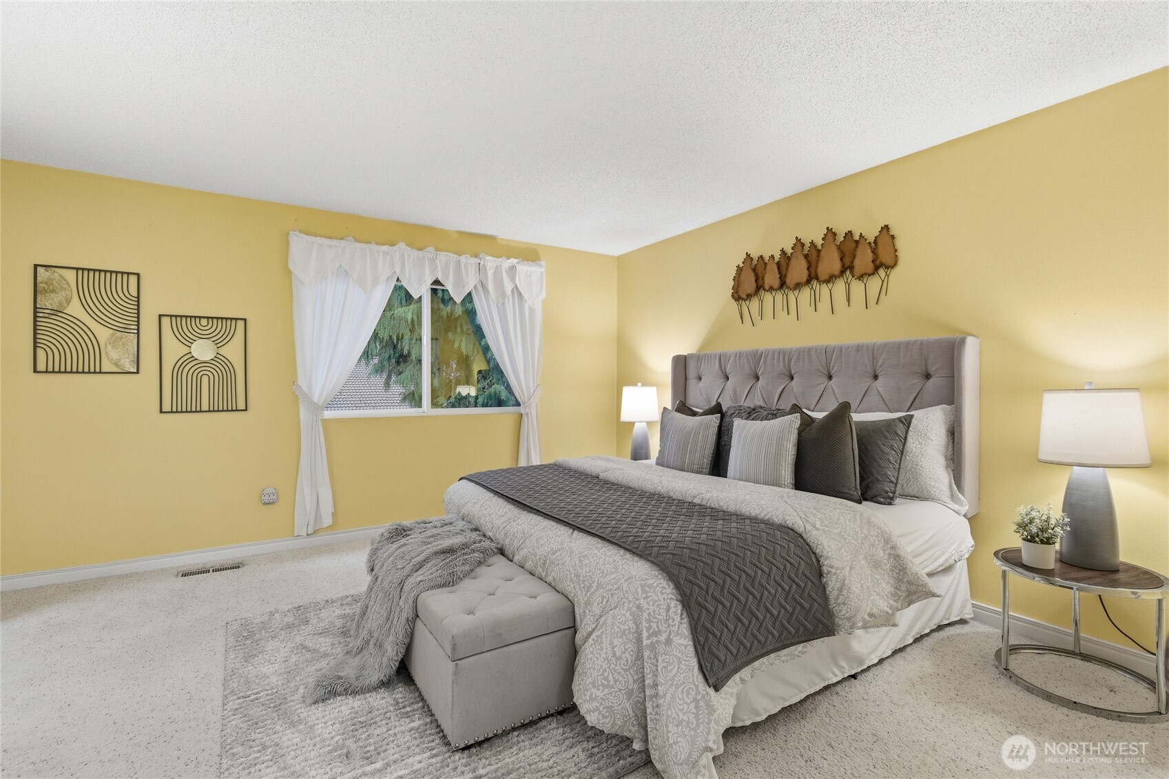 14523 Southeast 167th Street Renton, WA 98058 - Photo 32 of 39 a bedroom with a bed and a painting on the wall