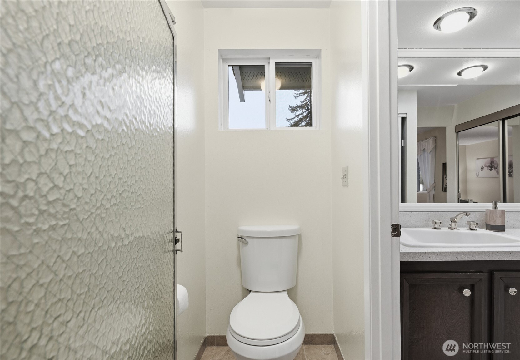 14523 Southeast 167th Street Renton, WA 98058 - Photo 34 of 39 a bathroom with a toilet a sink and mirror