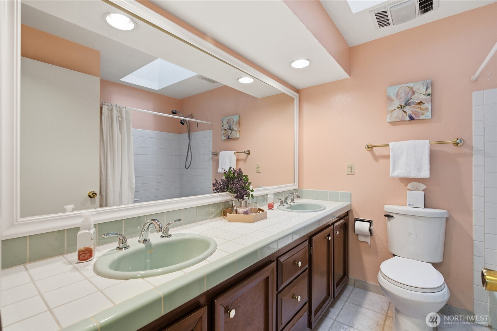 14523 Southeast 167th Street Renton, WA 98058 - Photo 36 of 39 a bathroom with a granite countertop sink a toilet and a mirror