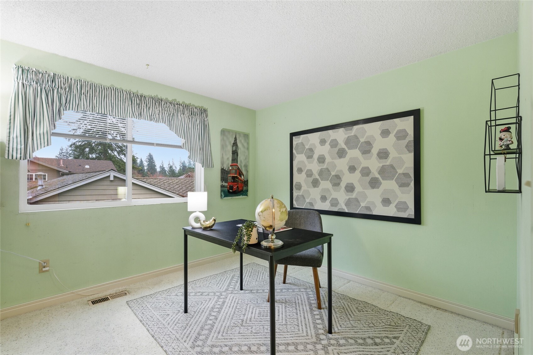 14523 Southeast 167th Street Renton, WA 98058 - Photo 37 of 39 a living room with furniture and a painting on the wall