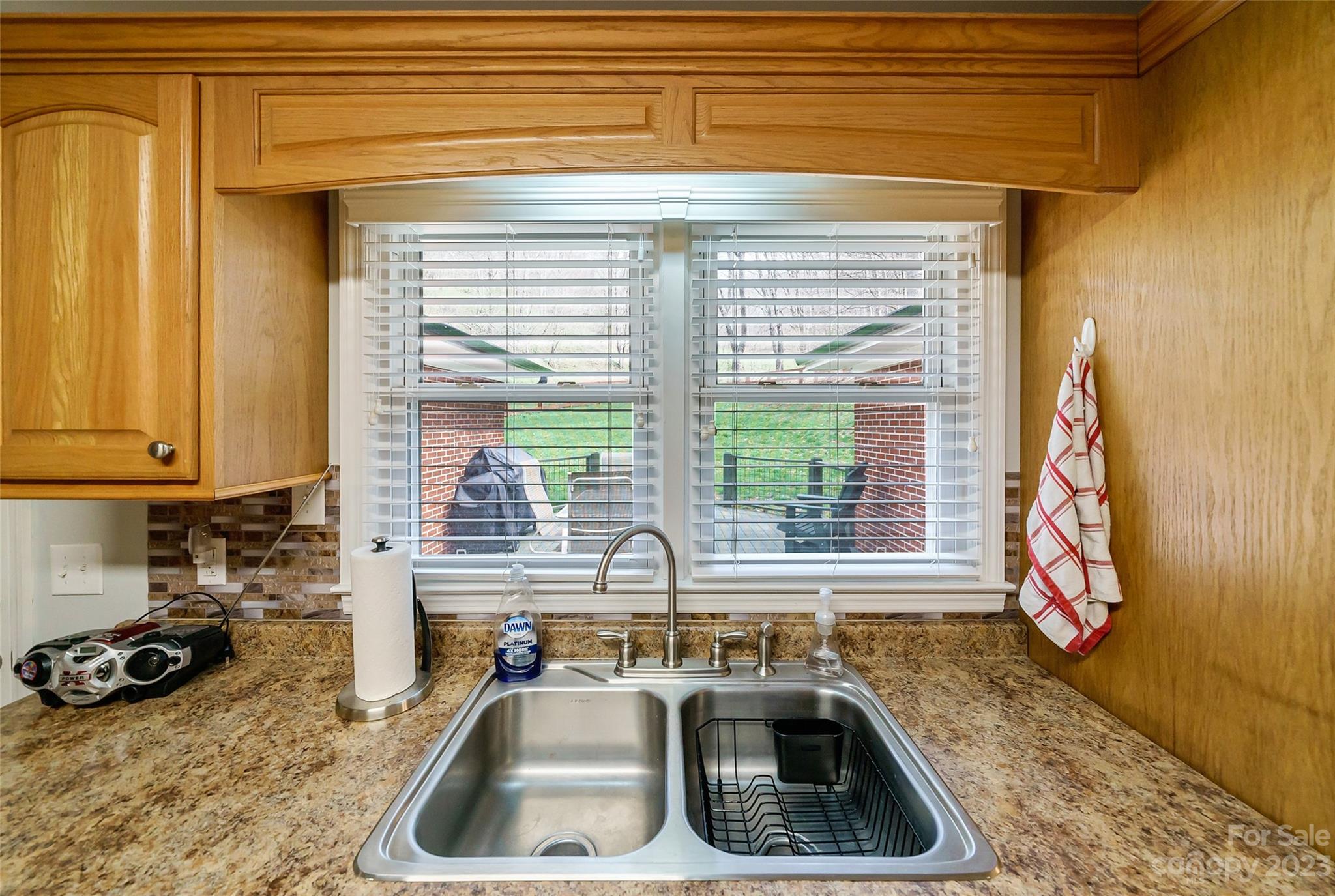 292 Welch Road Lansing, NC 28643 - Photo 12 of 47 a kitchen with a sink a window and cabinets