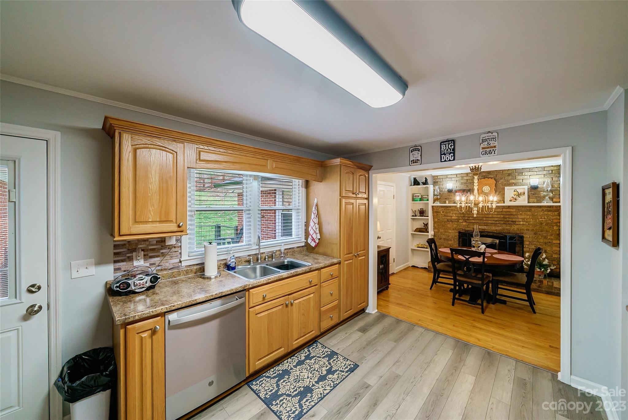 292 Welch Road Lansing, NC 28643 - Photo 13 of 47 a kitchen that has a sink and chairs
