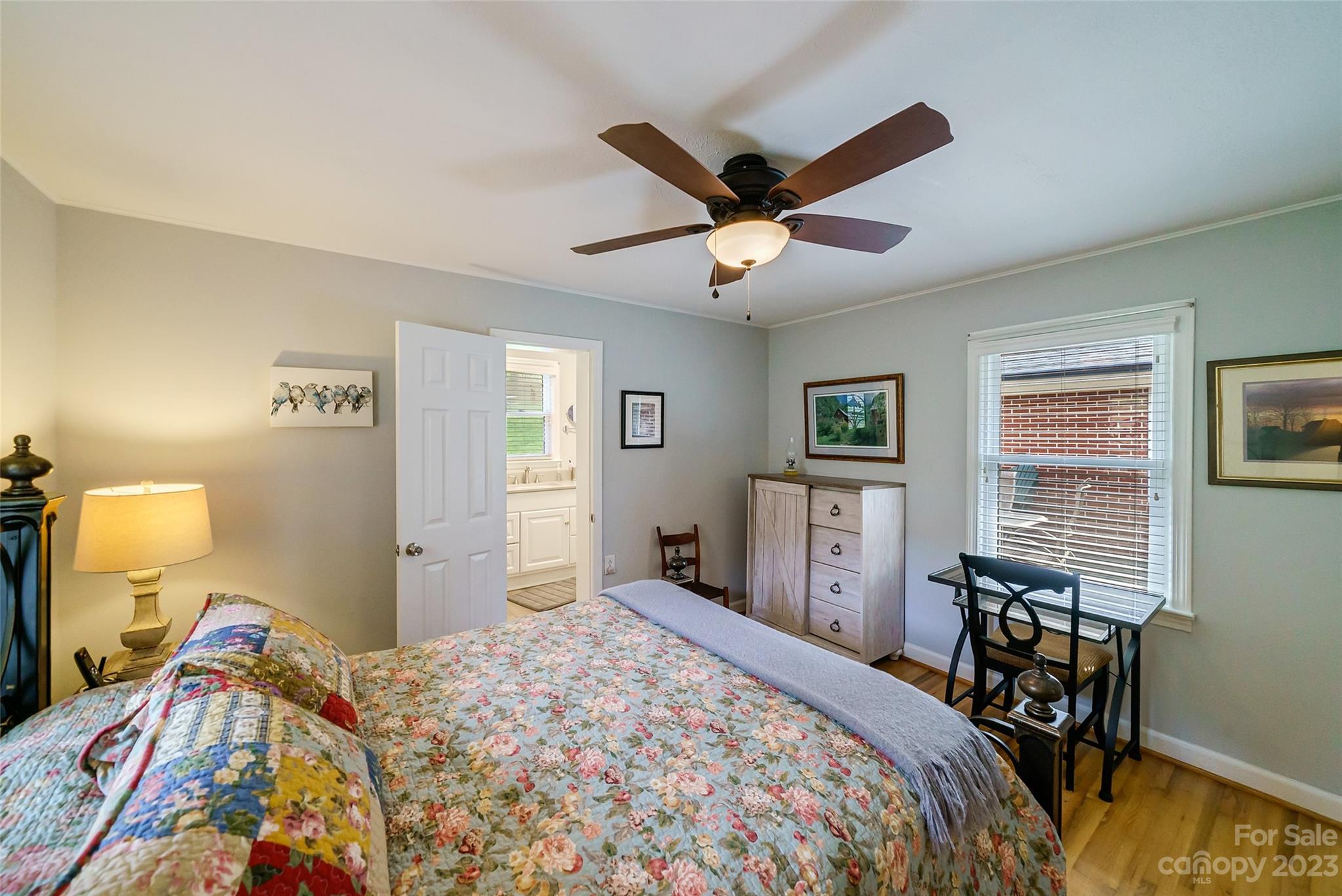 292 Welch Road Lansing, NC 28643 - Photo 16 of 47 a bedroom with a bed and wooden floor