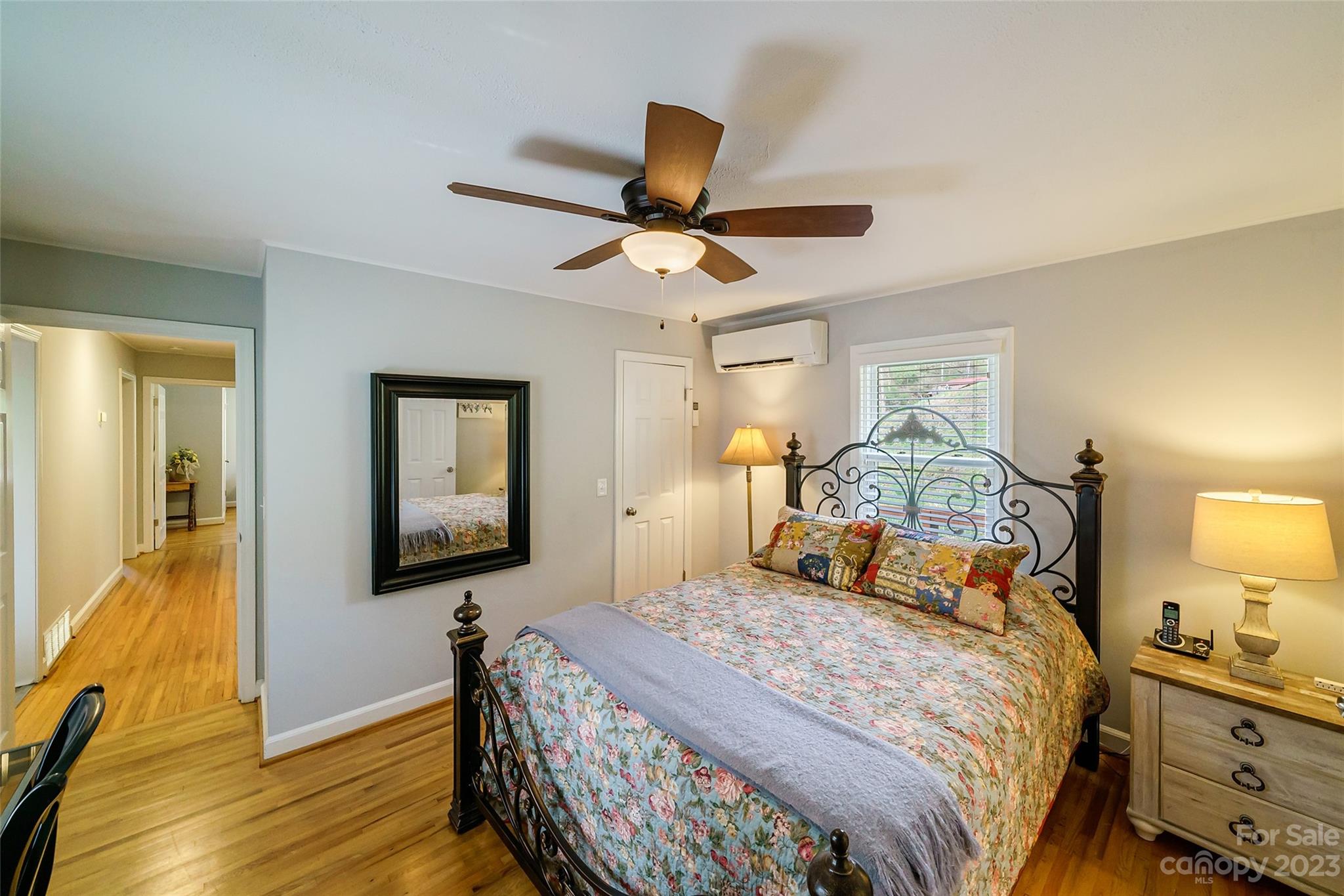 292 Welch Road Lansing, NC 28643 - Photo 17 of 47 a bedroom with a bed and wooden floor
