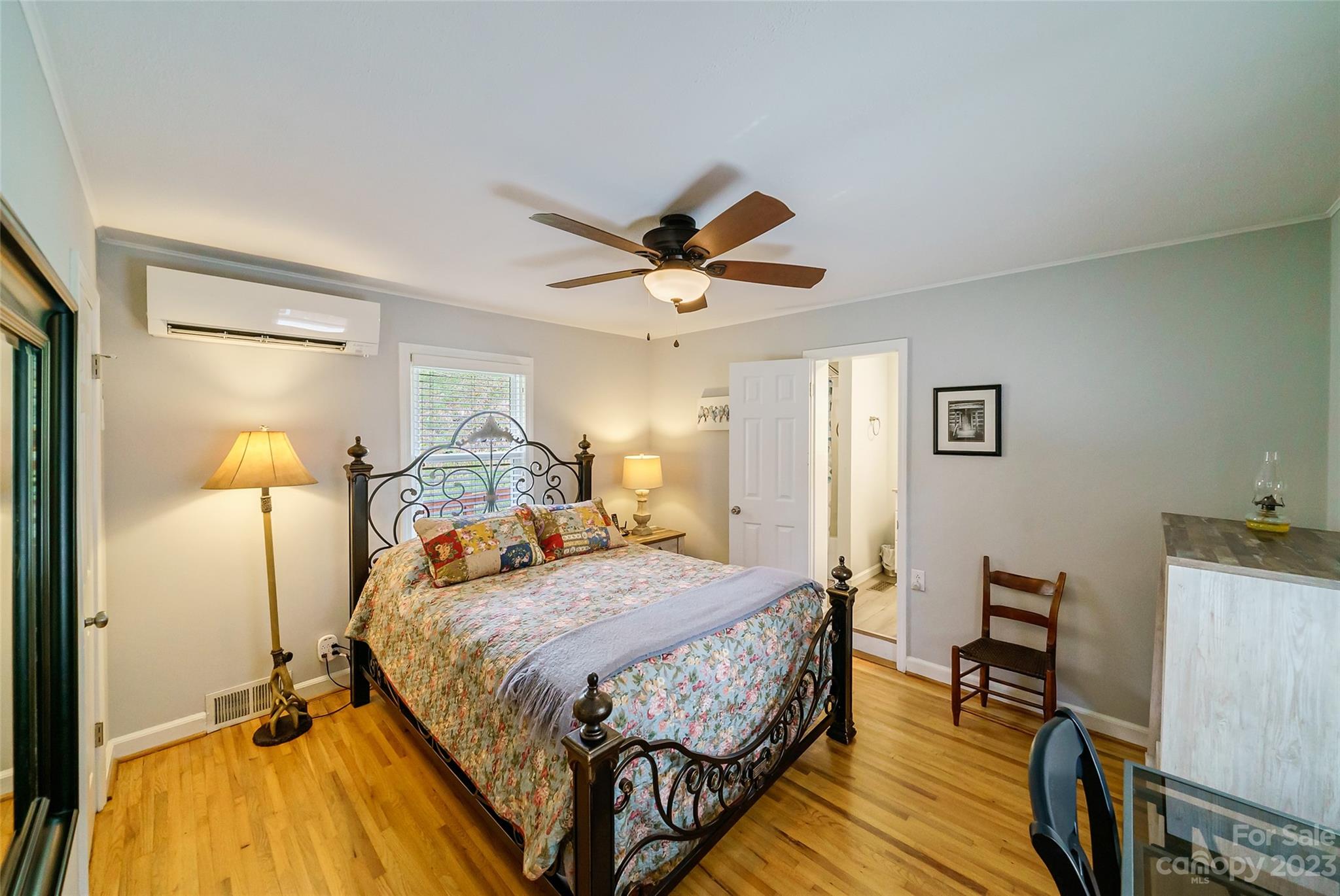 292 Welch Road Lansing, NC 28643 - Photo 18 of 47 a bedroom with a bed and wooden floor