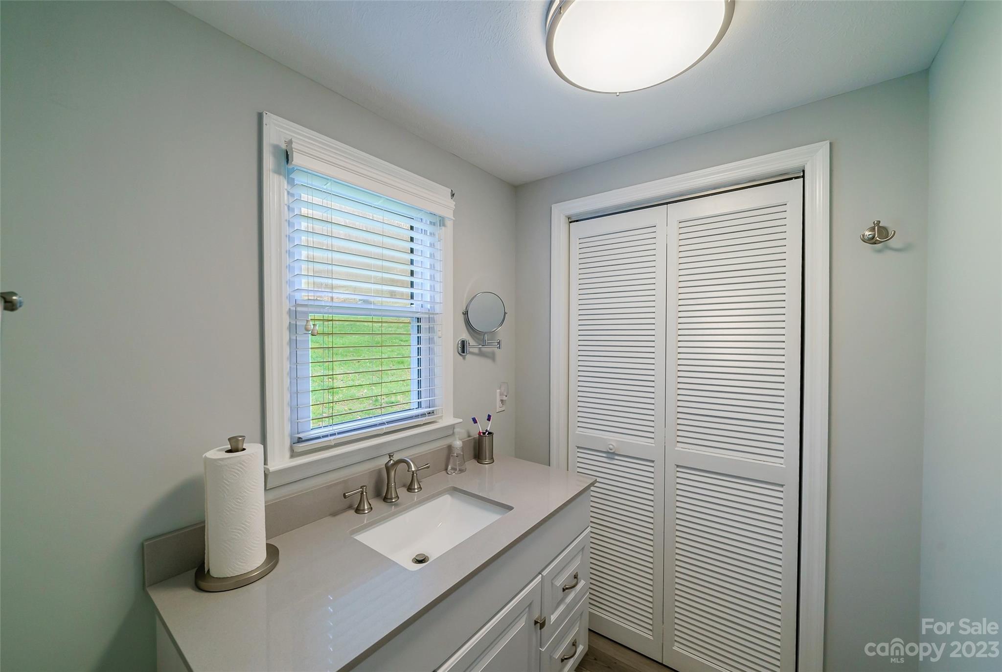292 Welch Road Lansing, NC 28643 - Photo 20 of 47 a bathroom with a sink and a mirror