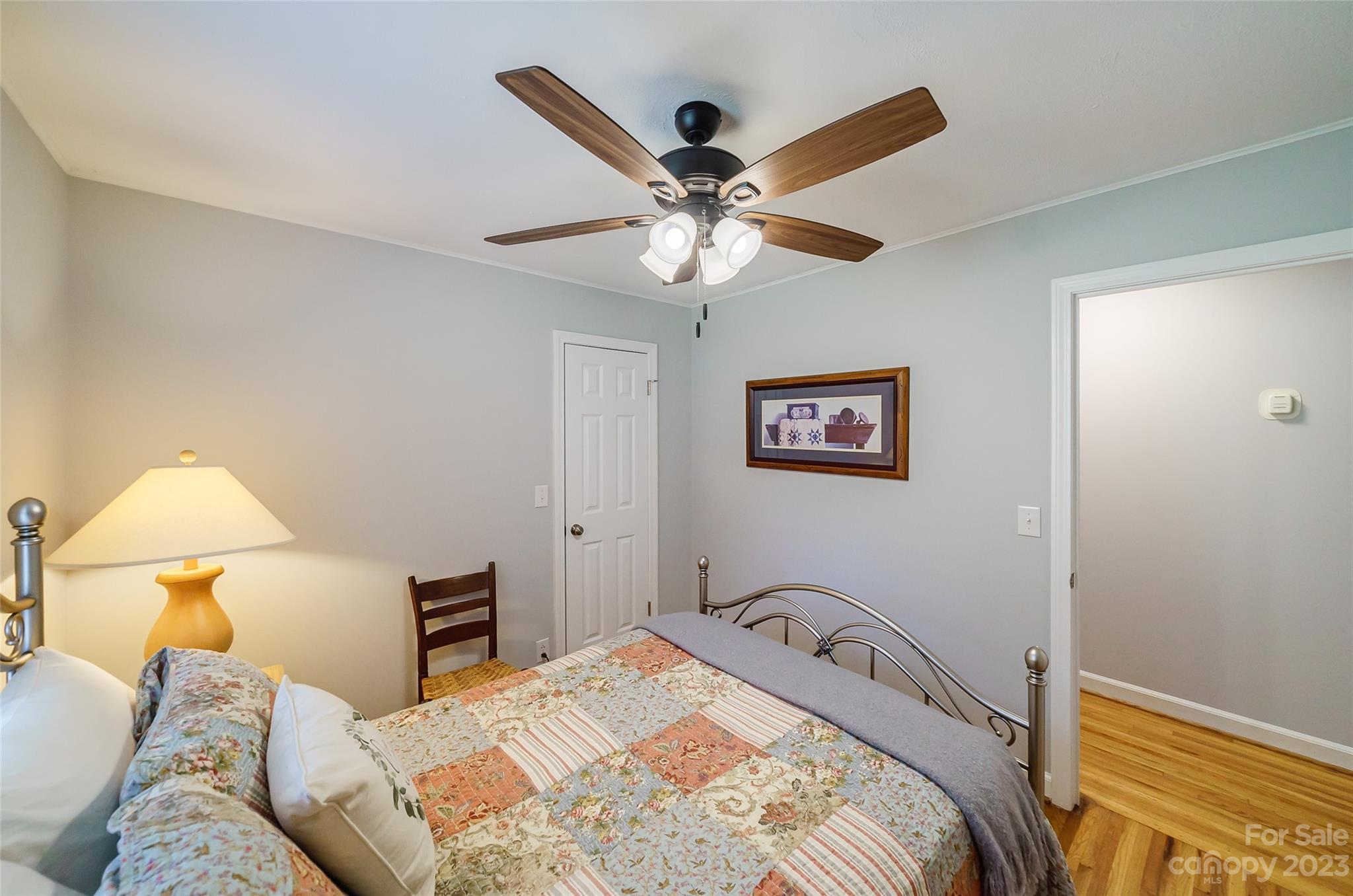 292 Welch Road Lansing, NC 28643 - Photo 22 of 47 a bedroom with a bed and a lamp