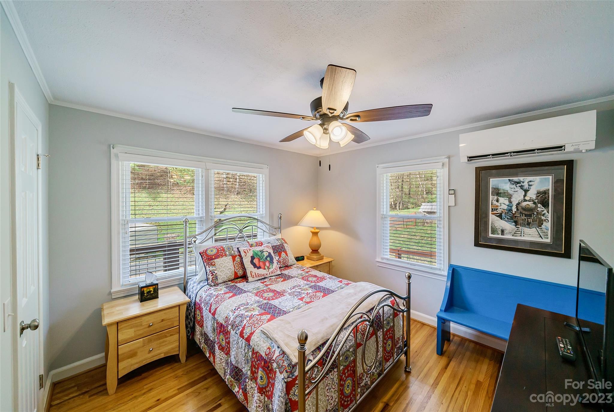 292 Welch Road Lansing, NC 28643 - Photo 25 of 47 a bedroom with a bed and wooden floor