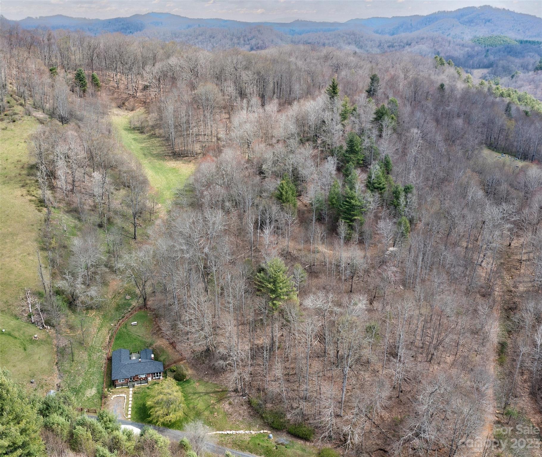 292 Welch Road Lansing, NC 28643 - Photo 40 of 47 an aerial view of mountain with trees around