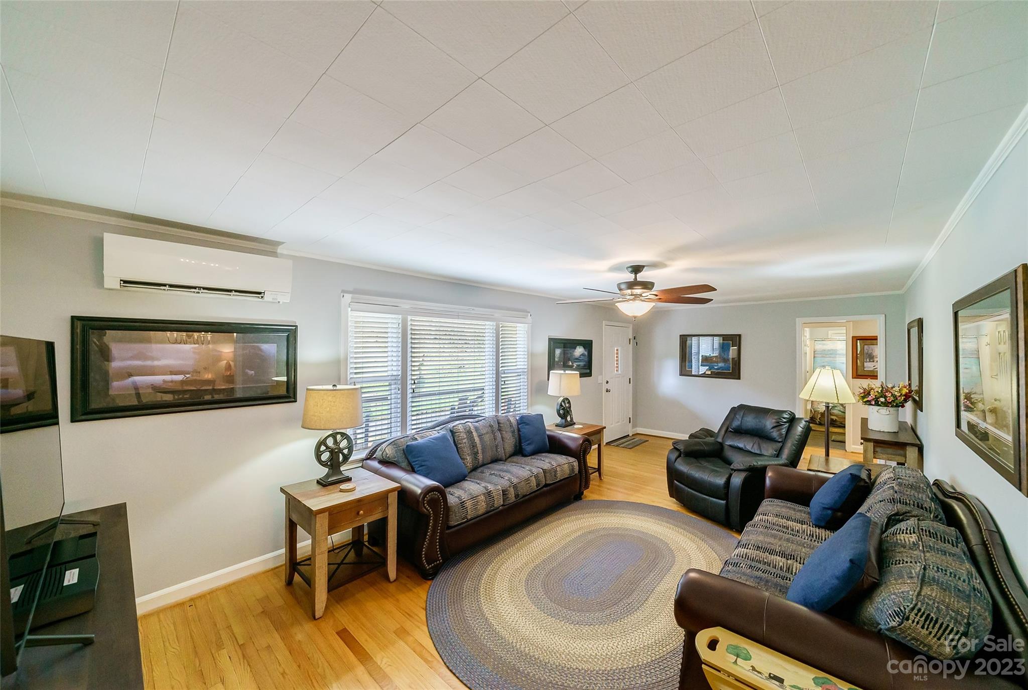 292 Welch Road Lansing, NC 28643 - Photo 4 of 47 a living room with furniture and a flat screen tv