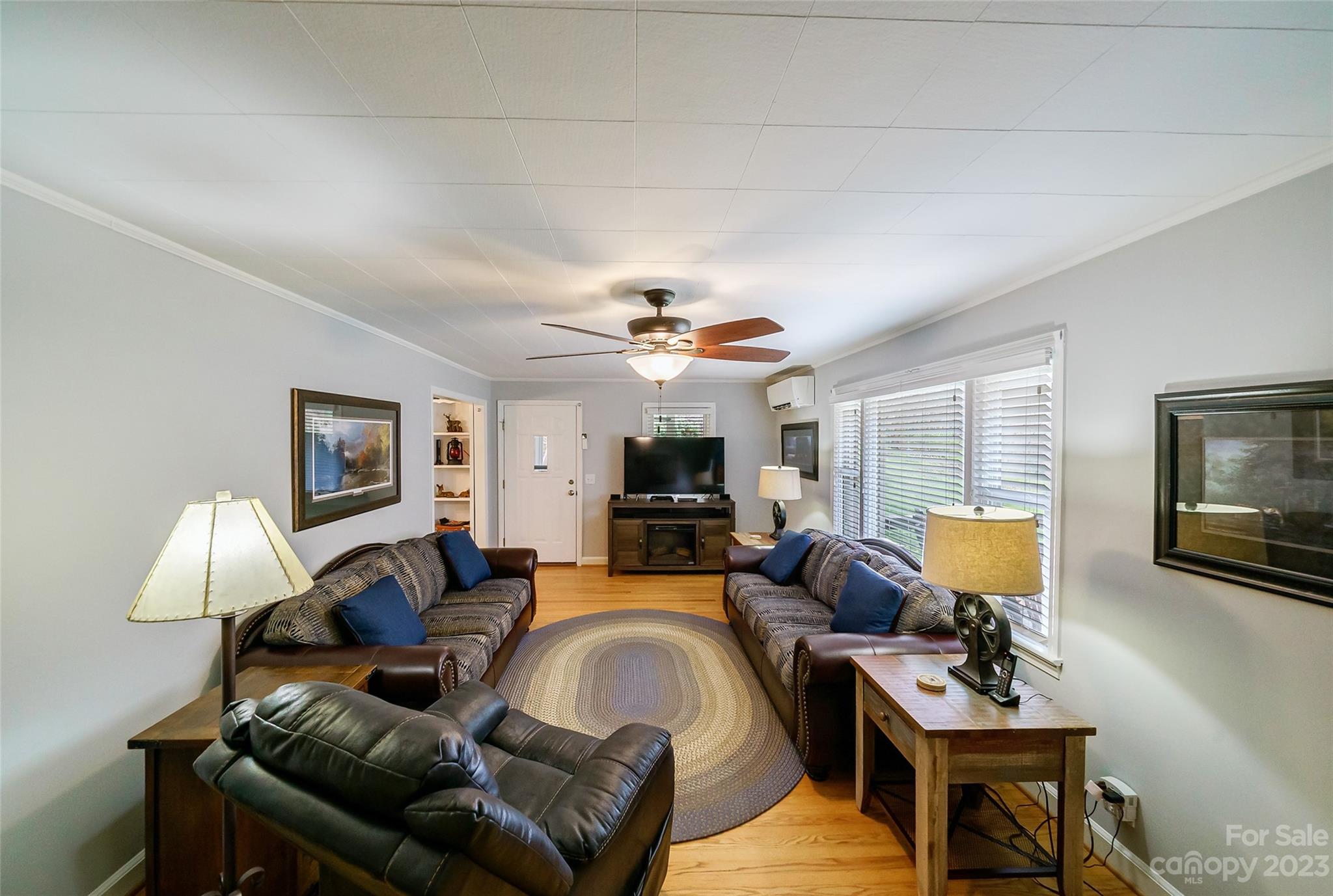 292 Welch Road Lansing, NC 28643 - Photo 5 of 47 a living room with furniture fireplace and a flat screen tv