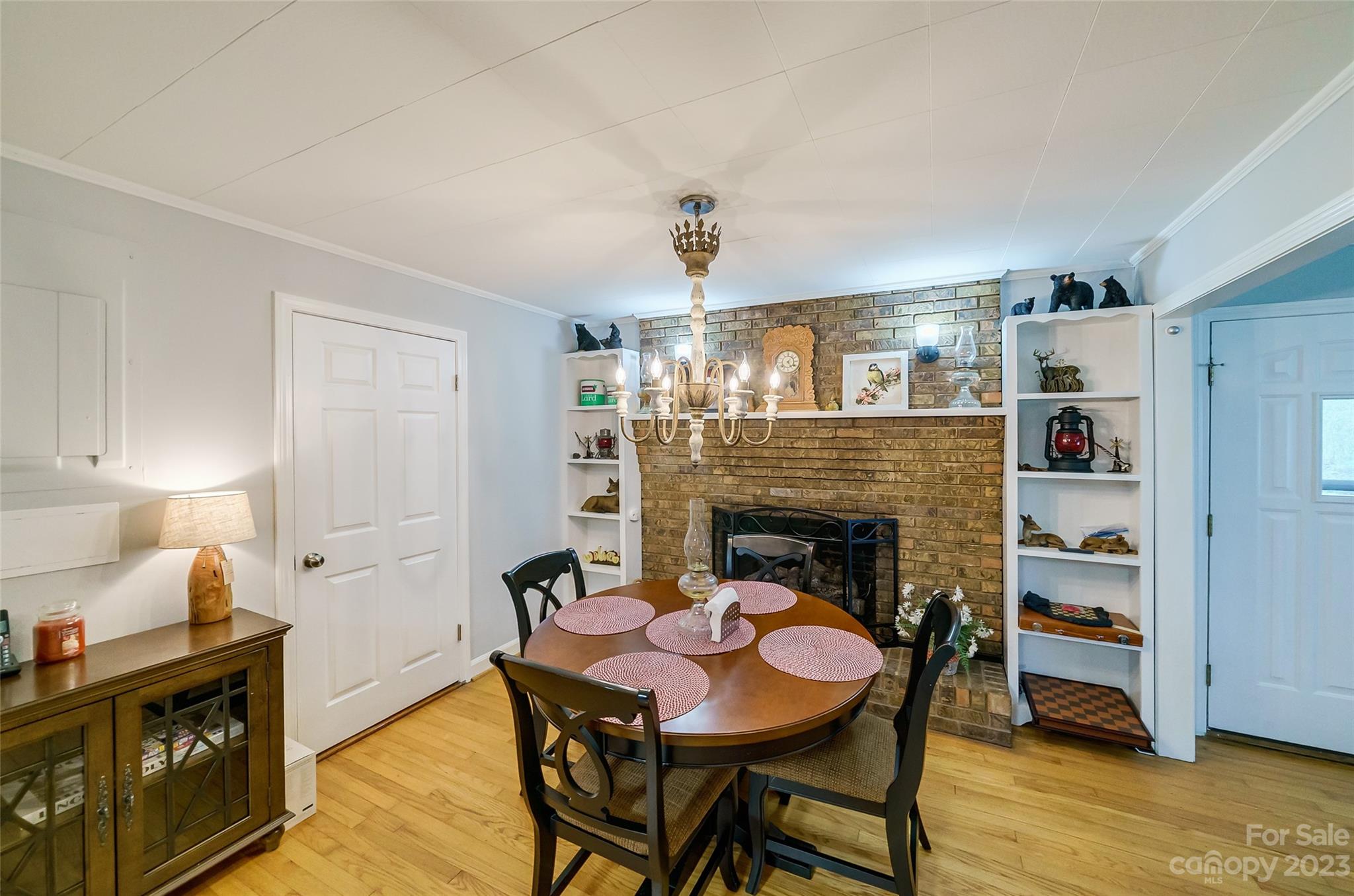 292 Welch Road Lansing, NC 28643 - Photo 7 of 47 a dining room with furniture and fireplace
