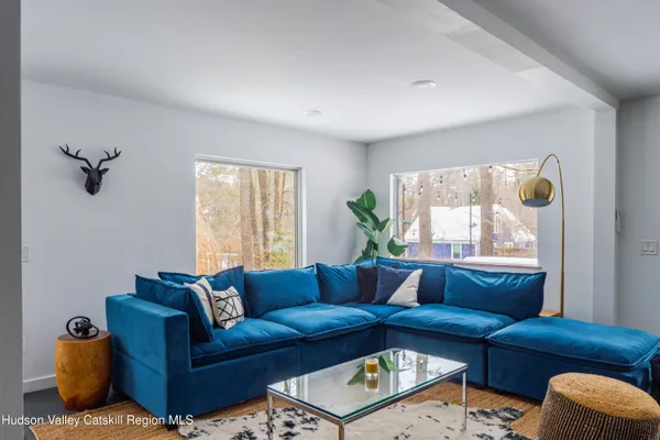 a living room with furniture and a window