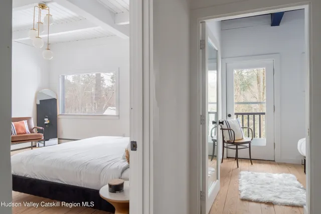 a bedroom with furniture and a fireplace