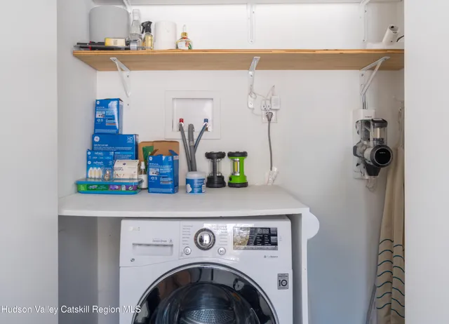 a bedroom with a bed and a chair