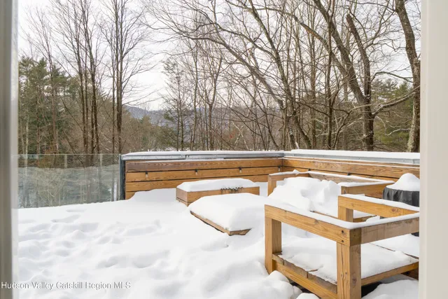 a backyard of a house with yard and outdoor seating