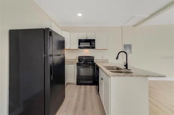 a bedroom with a bed and a chair