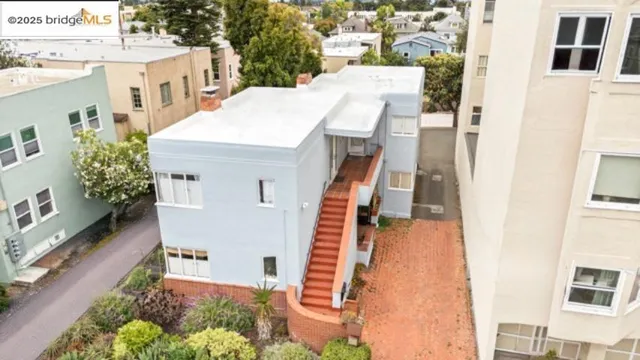 a view of a house with brick walls