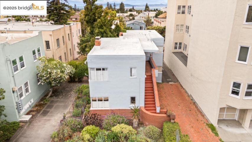 1682 Oxford Street Berkeley, CA 94709 - Photo 13 of 19 a view of a house with a yard and potted plants
