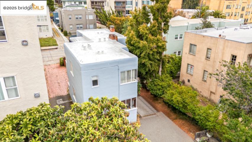 1682 Oxford Street Berkeley, CA 94709 - Photo 3 of 19 a picture of a house with a yard and potted plants
