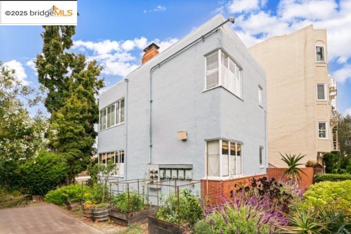 1682 Oxford Street Berkeley, CA 94709 - Photo 8 of 19 a front view of a house with plants and garden