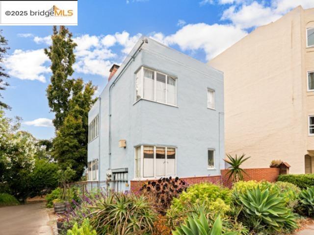 1682 Oxford Street Berkeley, CA 94709 - Photo 9 of 19 a front view of a house with a yard