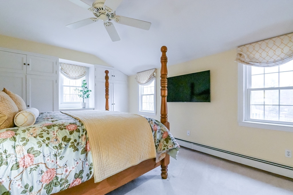 436 High Street Walpole, MA 02081 - Photo 15 of 42 a bedroom with a bed window and flat screen tv