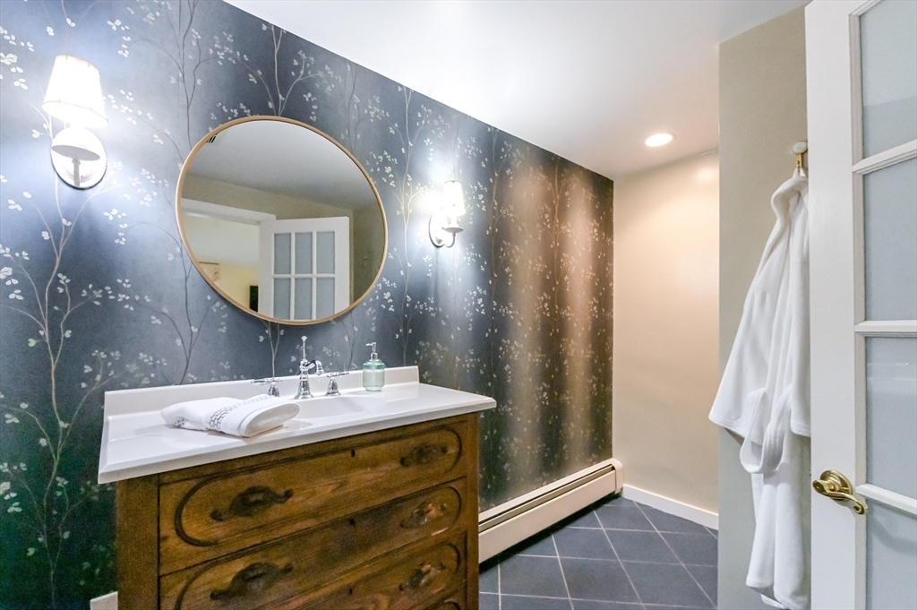 436 High Street Walpole, MA 02081 - Photo 17 of 42 a bathroom with a sink and a mirror