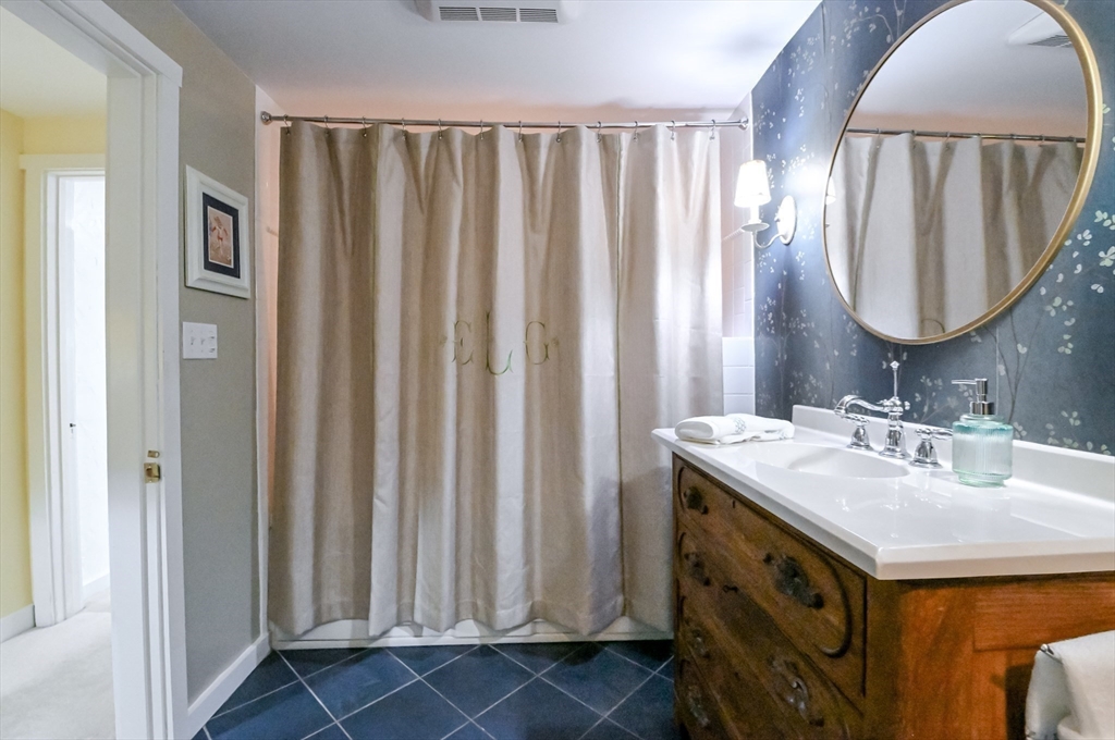 436 High Street Walpole, MA 02081 - Photo 18 of 42 a bathroom with a sink and a mirror