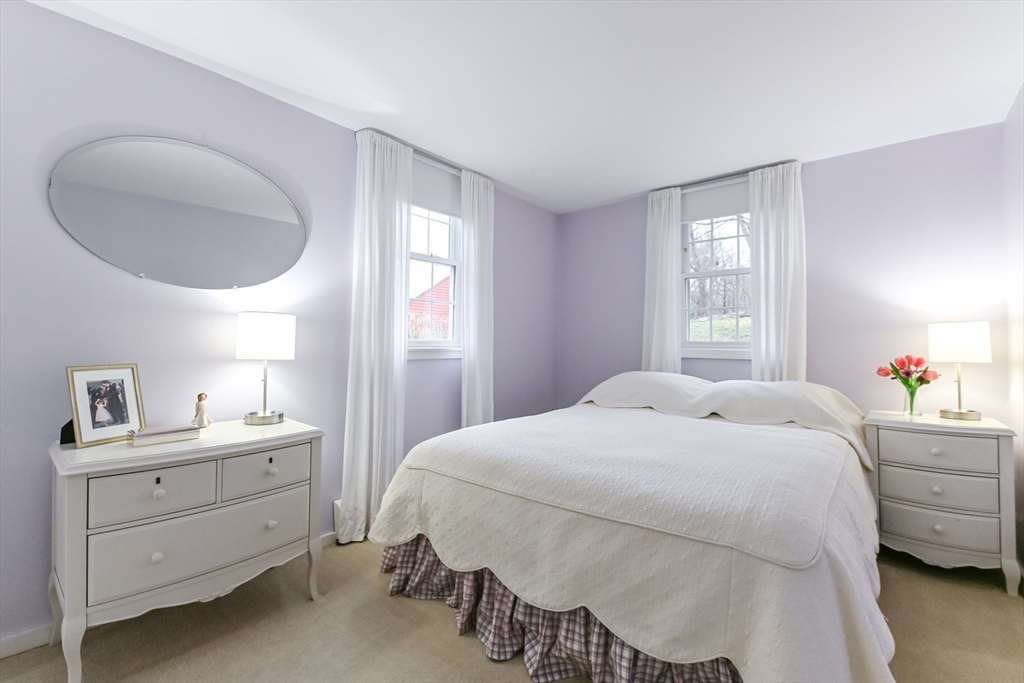 436 High Street Walpole, MA 02081 - Photo 19 of 42 a bedroom with a bed and a chair