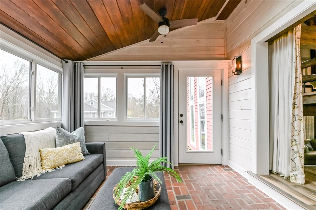 436 High Street Walpole, MA 02081 - Photo 25 of 42 a living room with furniture and a potted plant