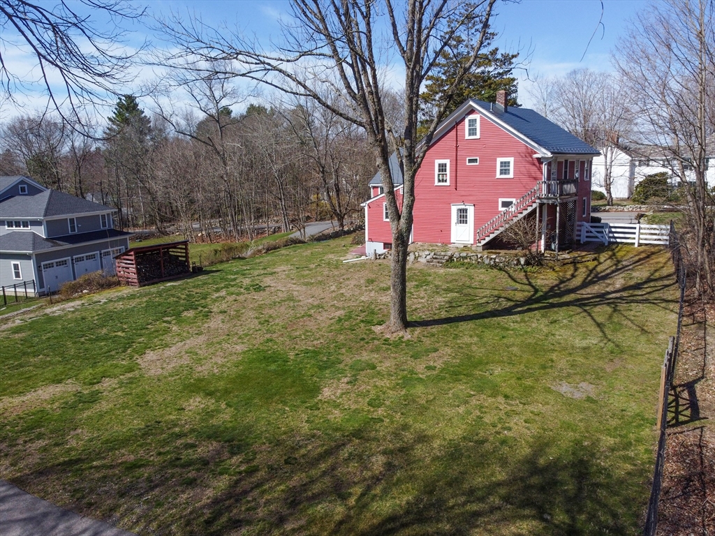 436 High Street Walpole, MA 02081 - Photo 35 of 42 a front view of a house with a yard