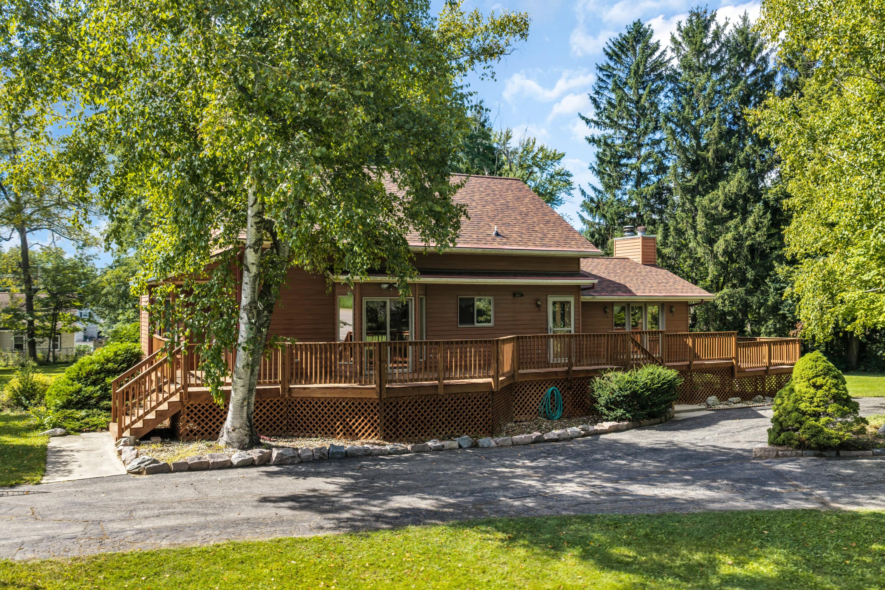 29510 Washington Avenue Rochester, WI 53105 - Photo 11 of 33 Rustic design with a nice approach and circle driveway