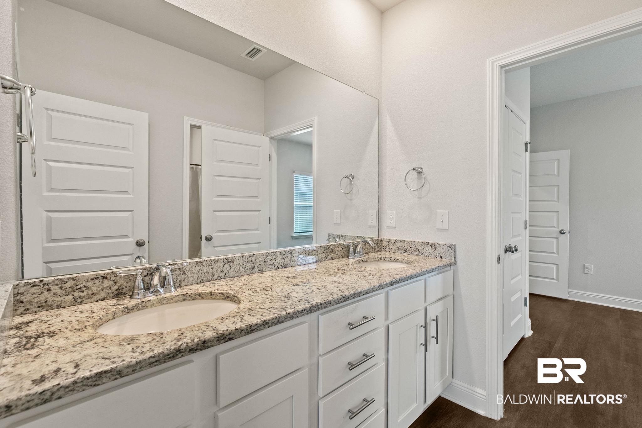 9448 Amethyst Drive Daphne, AL 36526 - Photo 33 of 61 Bathroom featuring double vanity and dark wood-type flooring