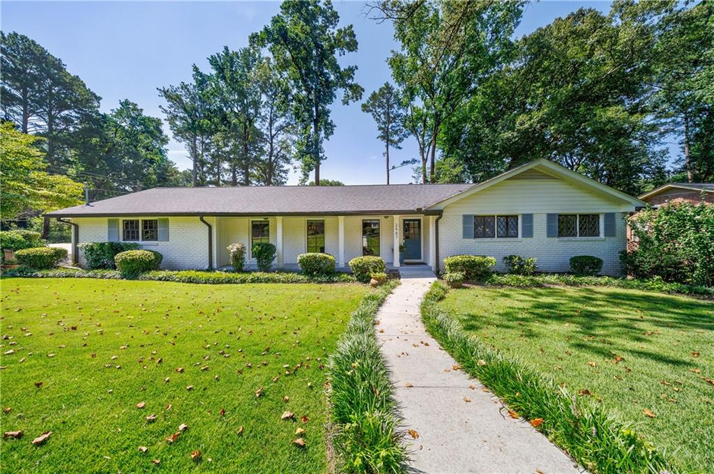 a front view of a house with yard porch and livingroom