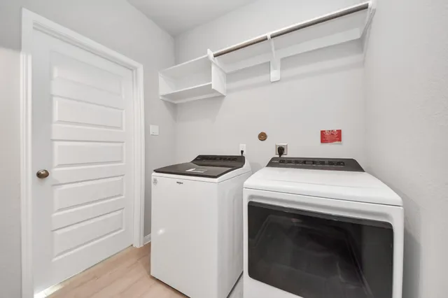 a utility room with washer and dryer