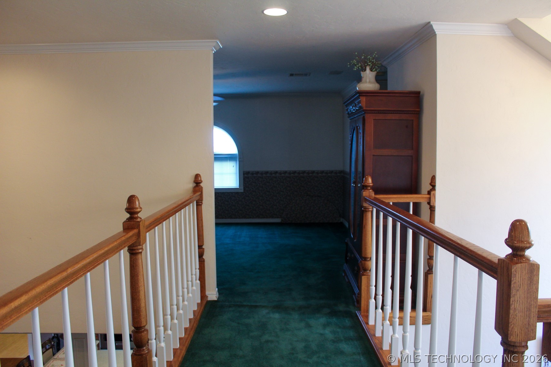 13248 North 3540th Road Maud, OK 74854 - Photo 80 of 98 Upper-level hallway featuring wood handrails and white balusters