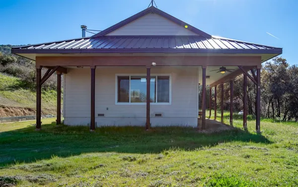 a view of a backyard of the house