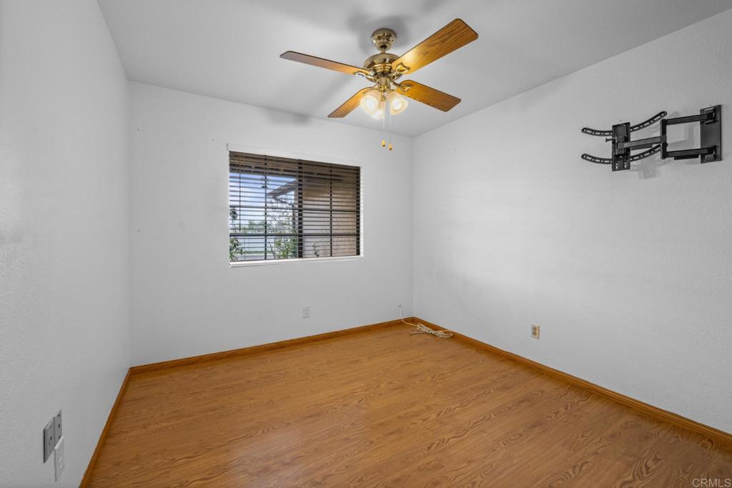 10254 Princess Joann Road Santee, CA 92071 - Photo 17 of 41 an empty room with a window and a ceiling fan